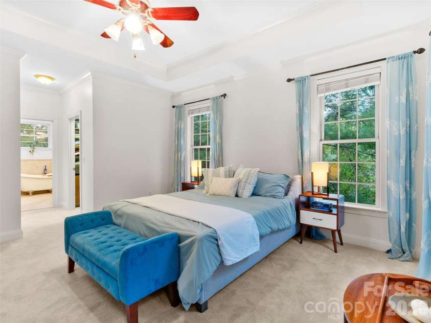 36 White Ash Drive, Asheville, NC 28803.  MLS# CAR4310417, YatesRealty ID 22580. Designed for comfort and ease, the main-level master suite features seamless access to the master bath and generous walk-in closets, making daily routines effortless.