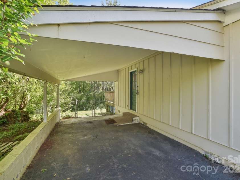 19 Clement Place, Asheville, NC 28805.  MLS# CAR4249307, YatesRealty ID 22582. Groceries come directly into the kitchen from the covered carport.