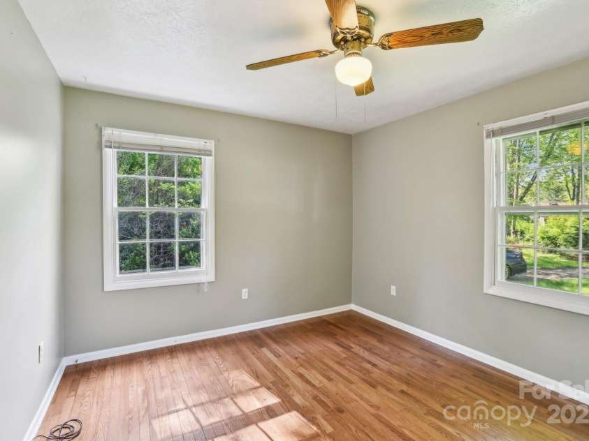 19 Clement Place, Asheville, NC 28805.  MLS# CAR4249307, YatesRealty ID 22582. The front corner bedroom features a hardwood floor and lots of light.