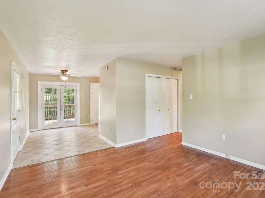 19 Clement Place, Asheville, NC 28805.  MLS# CAR4249307, YatesRealty ID 22582. The hallway runs to the right, with the kitchen just behind.