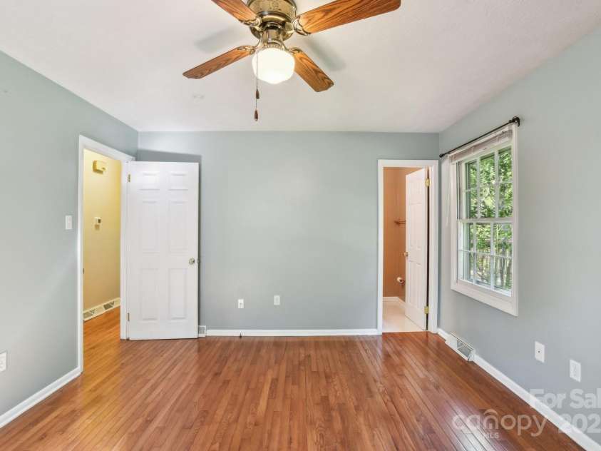 19 Clement Place, Asheville, NC 28805.  MLS# CAR4249307, YatesRealty ID 22582. The rear corner bedroom also has hardwood
