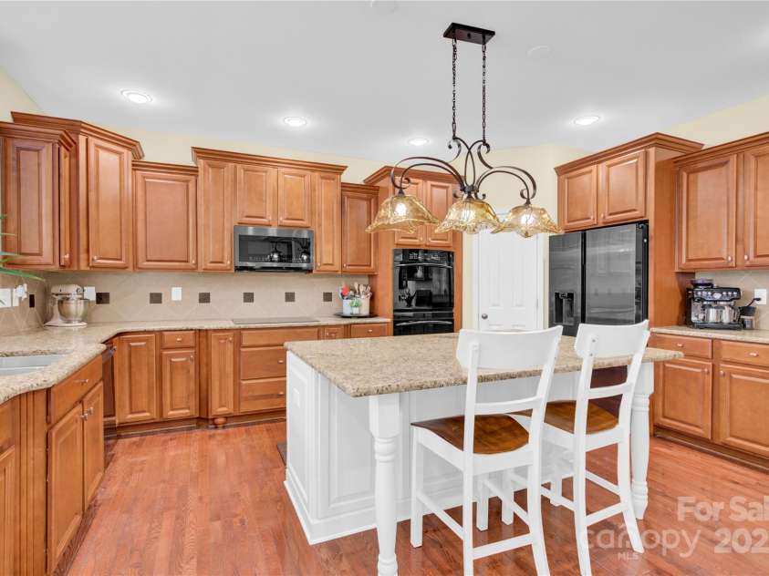 7480 Katelyn Court, Harrisburg, NC 28075.  MLS# CAR4263939, YatesRealty ID 22585. Kitchen with pull out shelving in cabinets