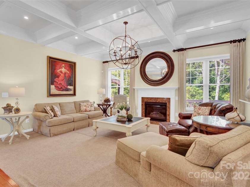 7480 Katelyn Court, Harrisburg, NC 28075.  MLS# CAR4263939, YatesRealty ID 22585. Living room with stunning coffered ceiling