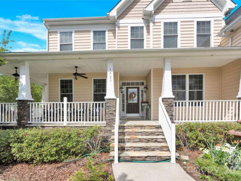 7480 Katelyn Court, Harrisburg, NC 28075.  MLS# CAR4263939, YatesRealty ID 22585. Partial wrap around porch with pleasing stonework