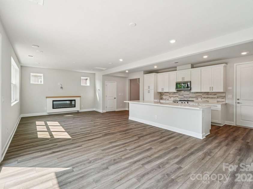 720 Flare Drive, Tega Cay, SC 29708.  MLS# CAR4267636, YatesRealty ID 22587. Dining room view to kitchen/great room