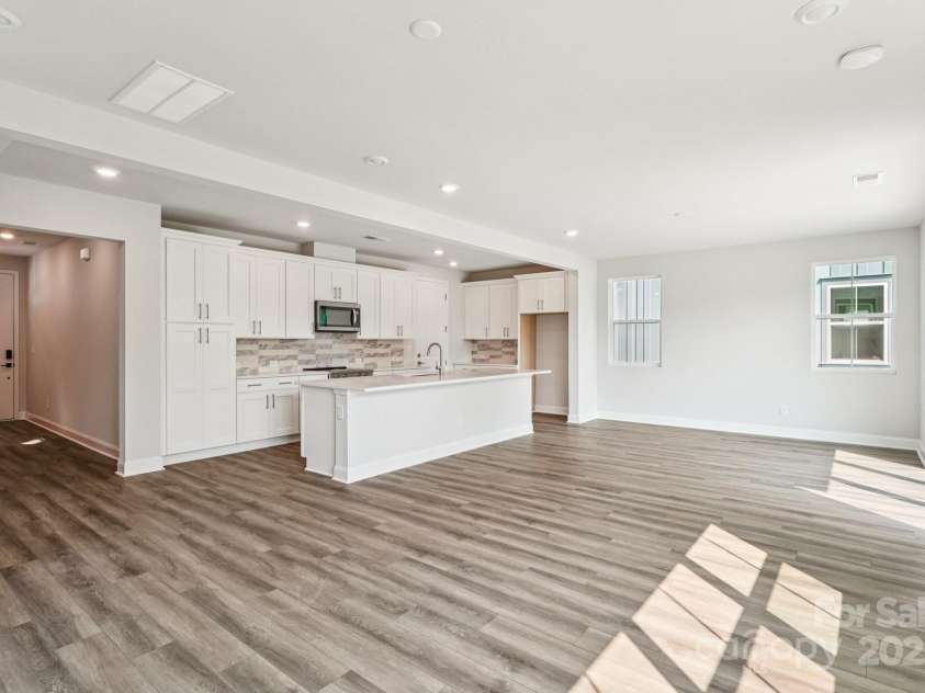 720 Flare Drive, Tega Cay, SC 29708.  MLS# CAR4267636, YatesRealty ID 22587. Great room view to kitchen