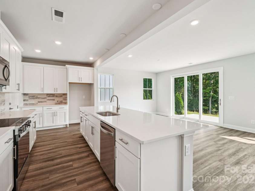720 Flare Drive, Tega Cay, SC 29708.  MLS# CAR4267636, YatesRealty ID 22587. Kitchen view to dining