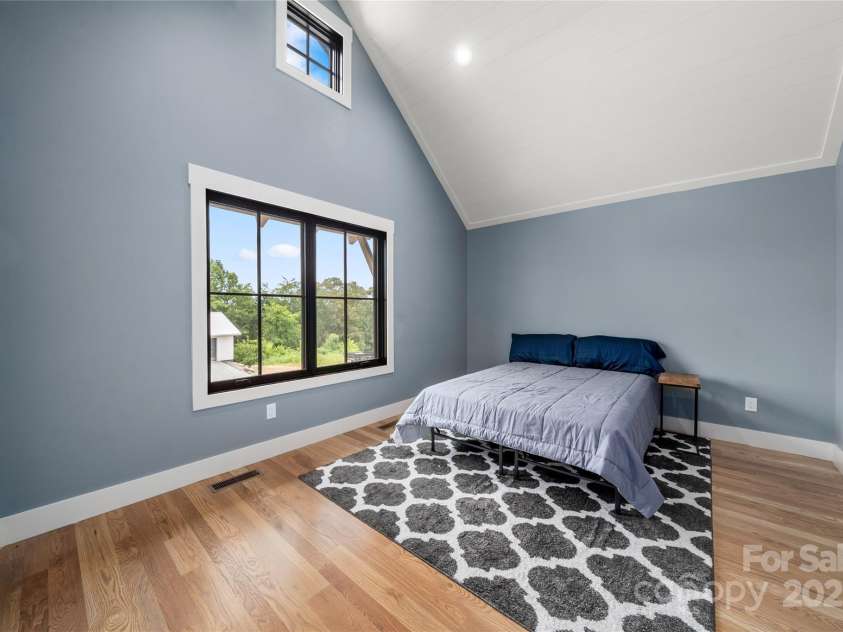 231 Westridge Farm Drive, Asheville, NC 28804.  MLS# CAR4265956, YatesRealty ID 22588. Bedroom with vaulted ceilings