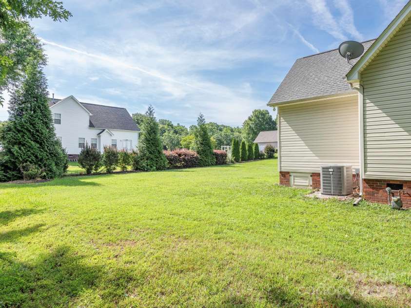 3697 Travertine Drive, Lancaster, SC 29720.  MLS# CAR4271522, YatesRealty ID 22592. Side Yard