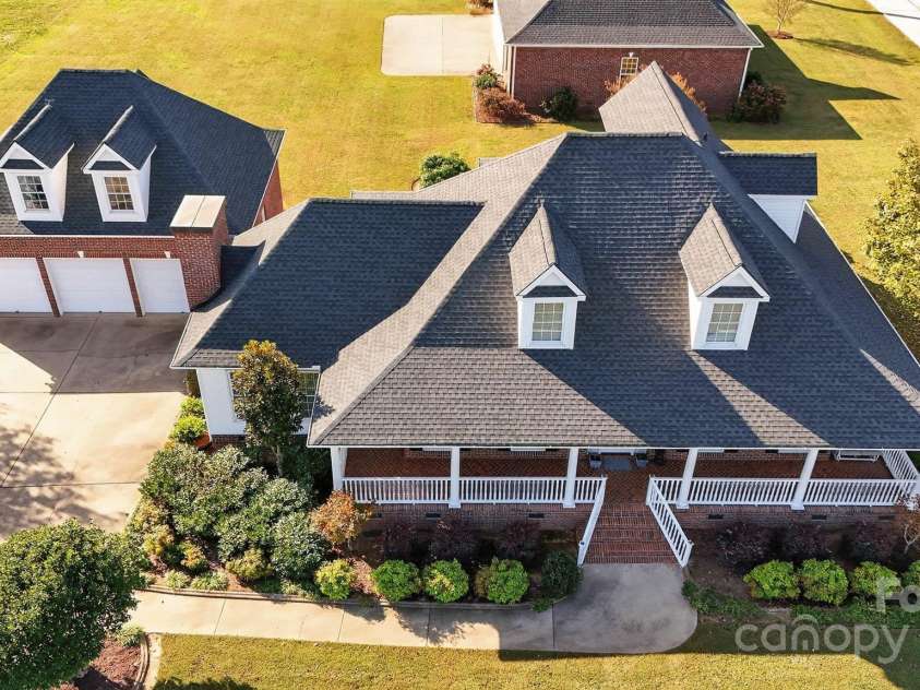 1004 Brockman Road, Greer, SC 29651.  MLS# CAR4312063, YatesRealty ID 226. Aerial showing house, garage and hangar