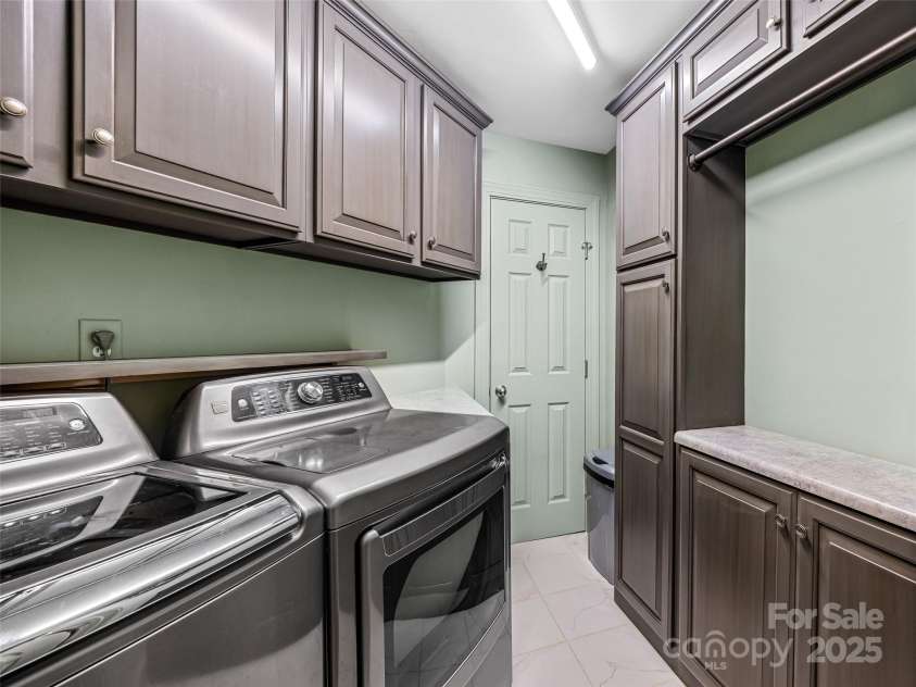 73 Ridgetop Circle, Brevard, NC 28712.  MLS# CAR4307459, YatesRealty ID 226. Laundry room on main level