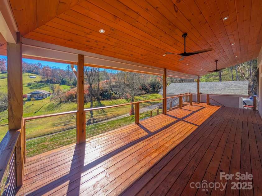 7854 US Highway 19E None, Burnsville, NC 28714.  MLS# CAR4319007, YatesRealty ID 2260. Additional view of covered back porch featuring tongue & groove ceiling, recessed lighting & outdoor ceiling fans. 