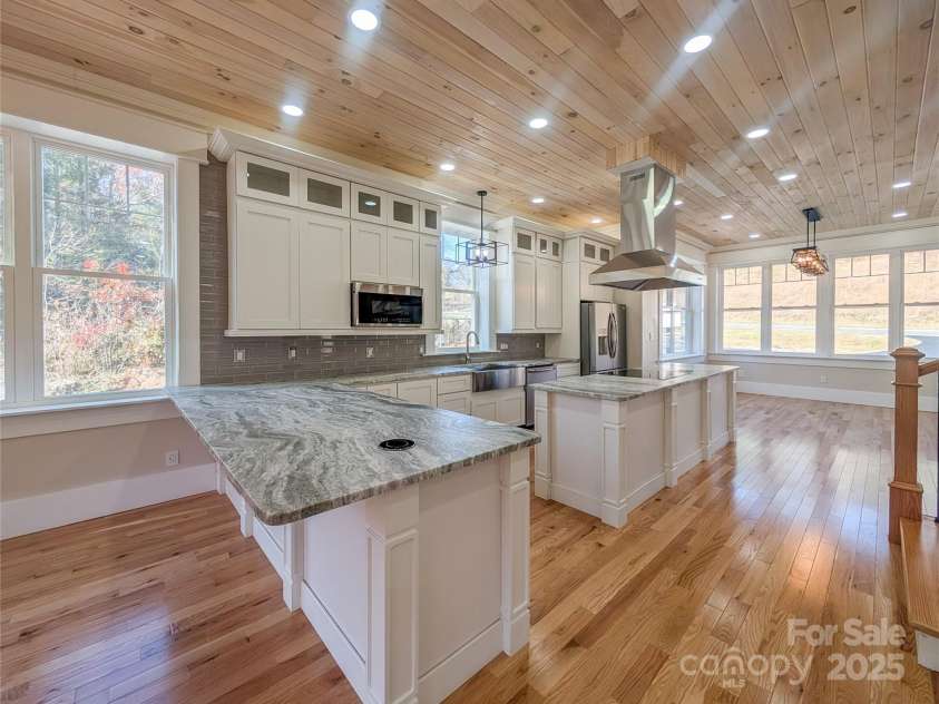7854 US Highway 19E None, Burnsville, NC 28714.  MLS# CAR4319007, YatesRealty ID 2260. Chef's Kitchen is truly a wonderful space & thoughtfully designed offering leather granite countertops, new Frigidaire appliance including induction range & air fryer microwave, abundant cabinetry with slow closin