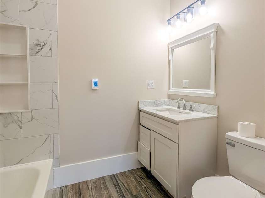 7854 US Highway 19E None, Burnsville, NC 28714.  MLS# CAR4319007, YatesRealty ID 2260. Full bathroom in first ensuite features heated tile floors with wi-fi thermostat