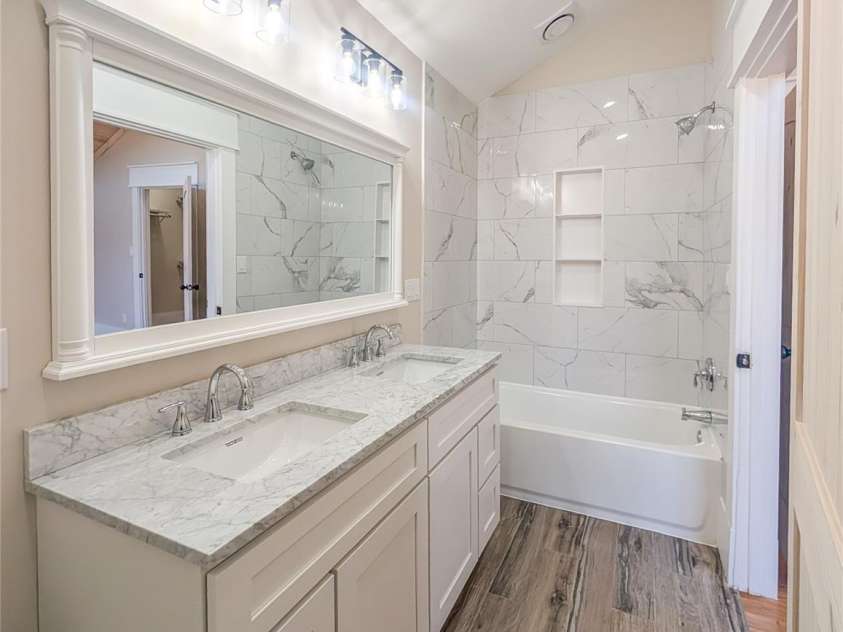 7854 US Highway 19E None, Burnsville, NC 28714.  MLS# CAR4319007, YatesRealty ID 2260. Full bathroom in first ensuite features heated tile floors with wi-fi thermostats