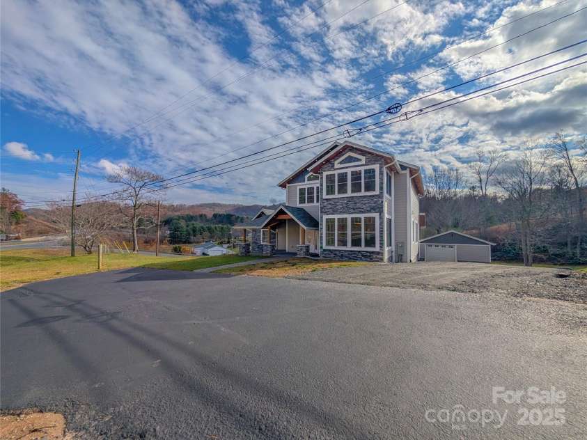 7854 US Highway 19E None, Burnsville, NC 28714.  MLS# CAR4319007, YatesRealty ID 2260. Parking available in paved area, gravel driveway & one car detached garage