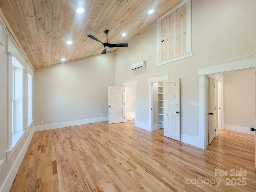 7854 US Highway 19E None, Burnsville, NC 28714.  MLS# CAR4319007, YatesRealty ID 2260. Second bedroom to right offers vaulted tongue & groove ceiling, recessed lighting, ceiling fan, large insulated pela windows showcasing mountain views, closet with built-in shelving, additional attic storage, larg