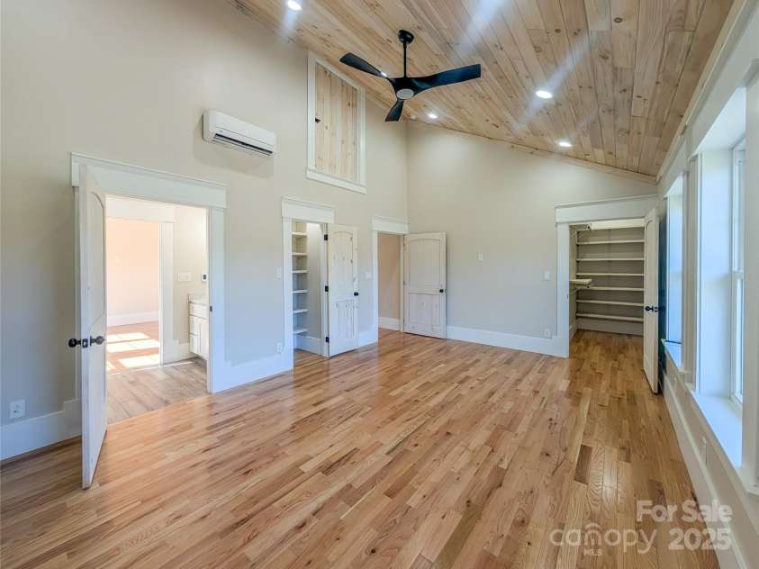 7854 US Highway 19E None, Burnsville, NC 28714.  MLS# CAR4319007, YatesRealty ID 2260. Second bedroom to right offers vaulted tongue & groove ceiling, recessed lighting, ceiling fan, large insulated pela windows showcasing mountain views, closet with built-in shelving, additional attic storage, larg