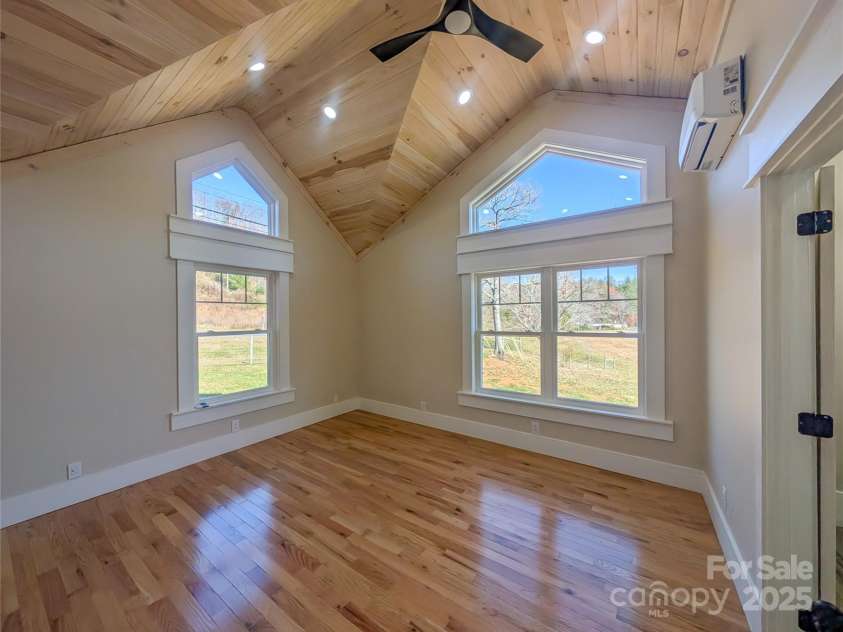7854 US Highway 19E None, Burnsville, NC 28714.  MLS# CAR4319007, YatesRealty ID 2260. Second Ensuite features architectural tongue & groove ceiling design with recessed lighting, ceiling fan, energy efficient mini-split, walk-in closet & full bathroom!