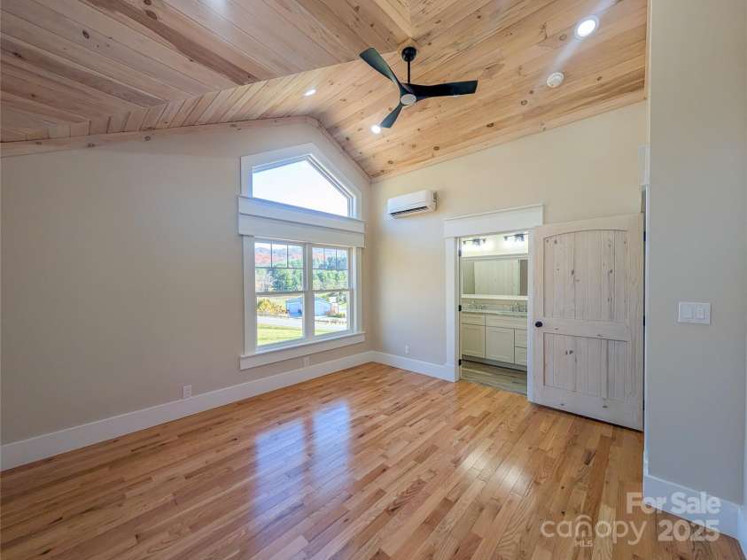 7854 US Highway 19E None, Burnsville, NC 28714.  MLS# CAR4319007, YatesRealty ID 2260. Second Ensuite features architectural tongue & groove ceiling design with recessed lighting, ceiling fan, energy efficient mini-split, walk-in closet & full bathroom!