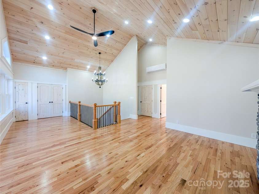 7854 US Highway 19E None, Burnsville, NC 28714.  MLS# CAR4319007, YatesRealty ID 2260. Second floor features open concept great room with stone fireplace, tongue & groove vaulted ceiling, recessed lighting, ceiling fan, second laundry room & closet with built-in shelving. This space offers flexibili
