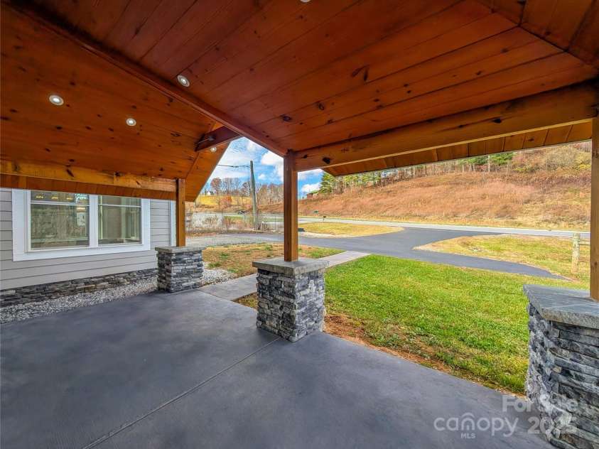 7854 US Highway 19E None, Burnsville, NC 28714.  MLS# CAR4319007, YatesRealty ID 2260. View from covered front porch showing access of Hwy 19E