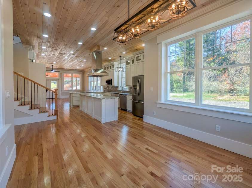 7854 US Highway 19E None, Burnsville, NC 28714.  MLS# CAR4319007, YatesRealty ID 2260. View from optional dining area looking toward chef's kitchen and optional living area. The open concept design allows for your choice when deciding how to use this well thought out space!
