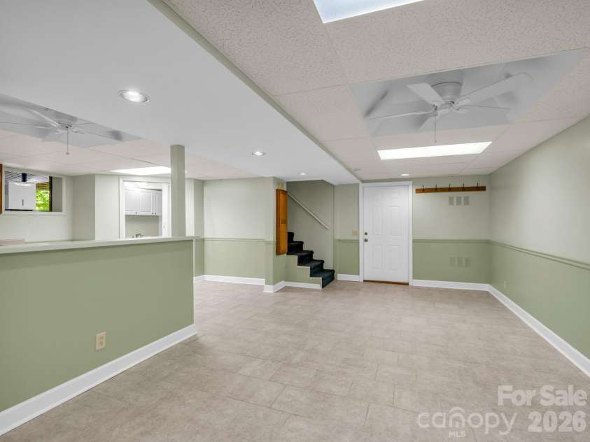156 Deer Run, Hendersonville, NC 28739.  MLS# CAR4397683, YatesRealty ID 22616. Lower-Level Recreation Area