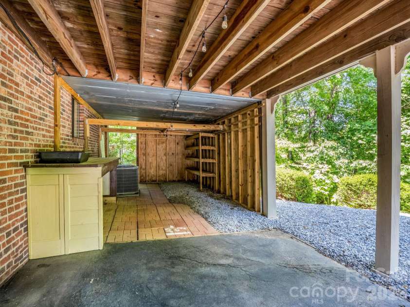 156 Deer Run, Hendersonville, NC 28739.  MLS# CAR4397683, YatesRealty ID 22616. Under Deck Storage area