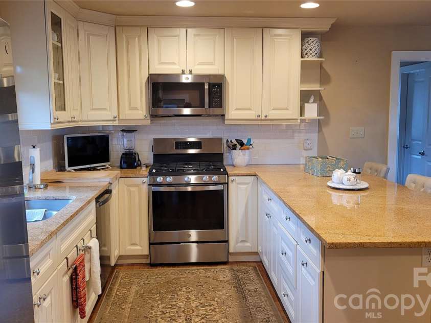 44 Dane Acres Drive, Alexander, NC 28701.  MLS# CAR4368207, YatesRealty ID 22624. Carriage House Kitchen with washer/dryer closet