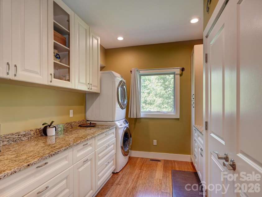 44 Dane Acres Drive, Alexander, NC 28701.  MLS# CAR4368207, YatesRealty ID 22624. Main floor laundry with stainless laundry tub