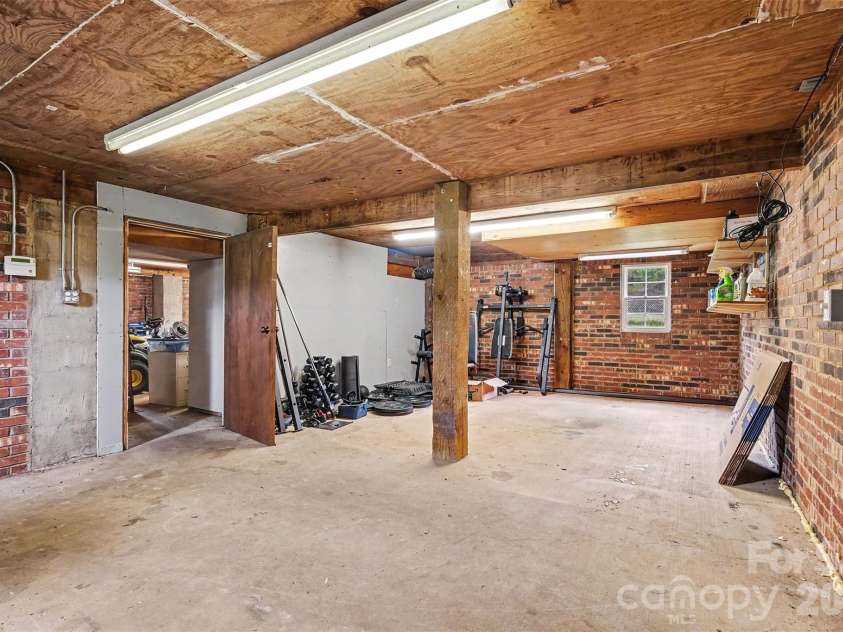 2960 Lavina Lane, Claremont, NC 28610.  MLS# CAR4380522, YatesRealty ID 22626. Workshop - Basement