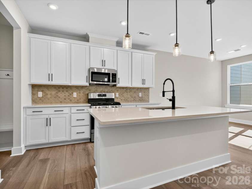 212 Halemarg Drive, Belmont, NC 28012.  MLS# CAR4305679, YatesRealty ID 22631. Chef Inspired Kitchen with White Cabinets and Quartz Countertop