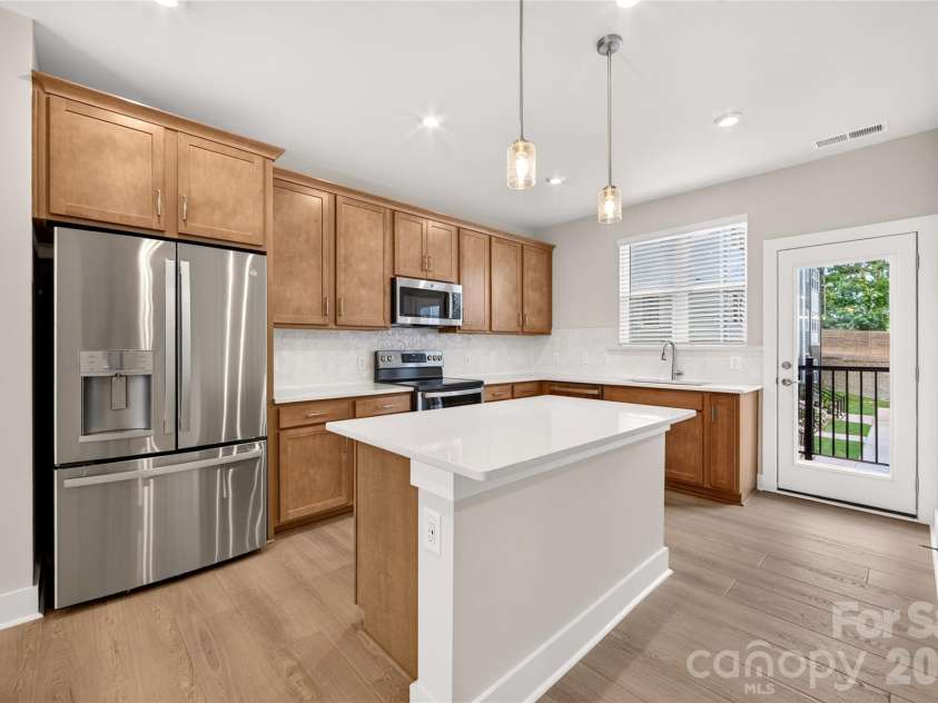 1530 Levy Way, Charlotte, NC 28205.  MLS# CAR4318066, YatesRealty ID 22632. Bright Kitchen with Window Over Sink