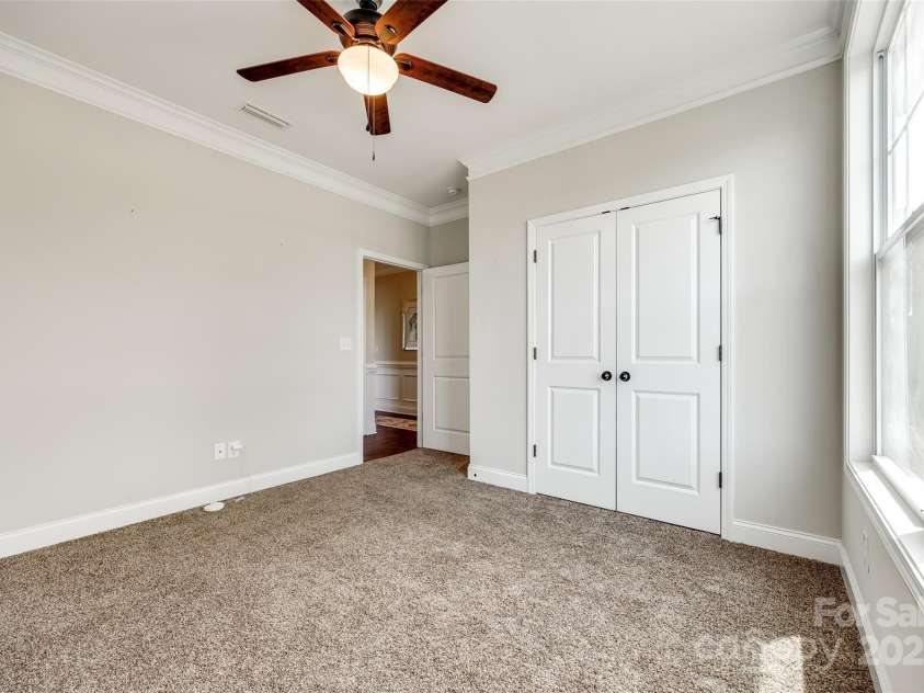 124 Rosebay Drive, Mooresville, NC 28117.  MLS# CAR4246450, YatesRealty ID 22636. Guest bed on main