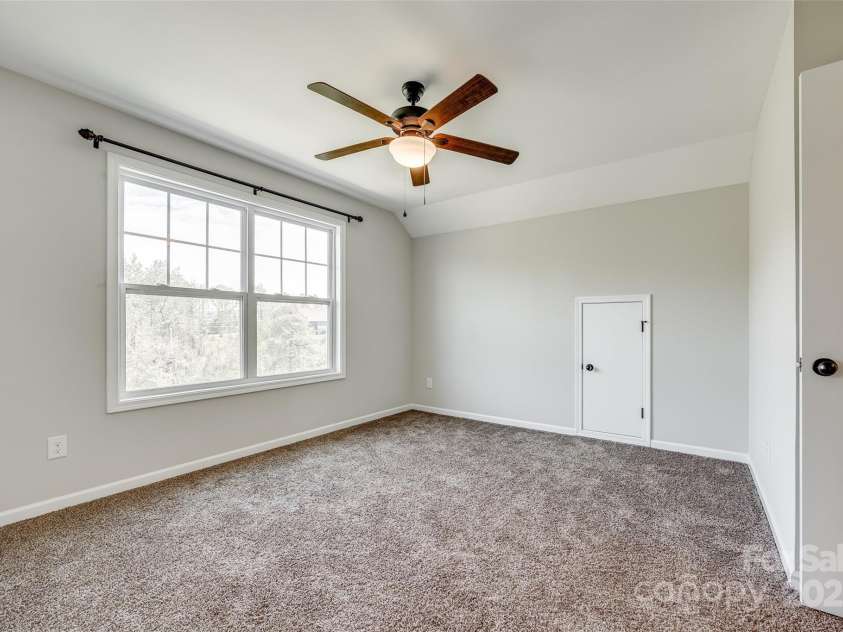 124 Rosebay Drive, Mooresville, NC 28117.  MLS# CAR4246450, YatesRealty ID 22636. Upstairs guest bed