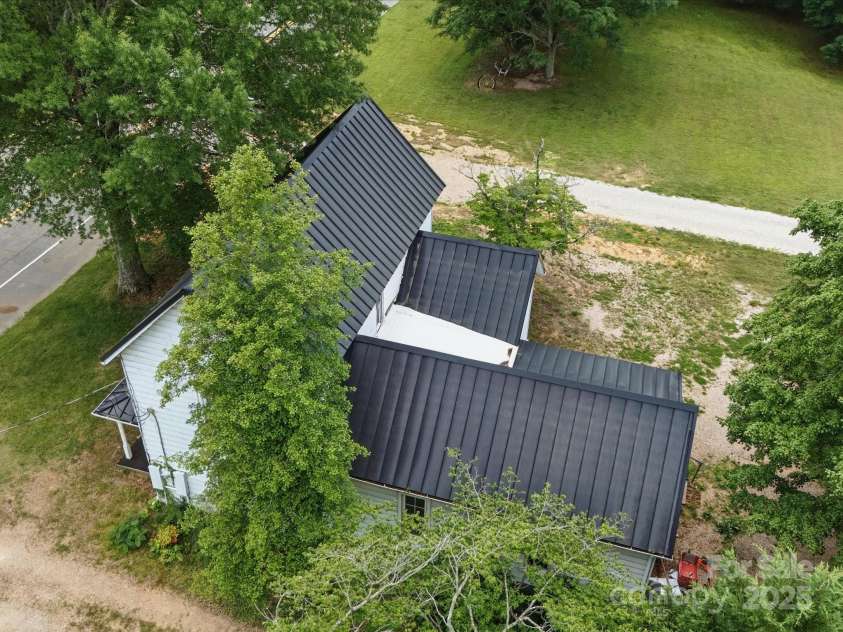 828 Main Street, Mount Pleasant, NC 28124.  MLS# CAR4264431, YatesRealty ID 22637. Aerial View showing new aluminum roof!