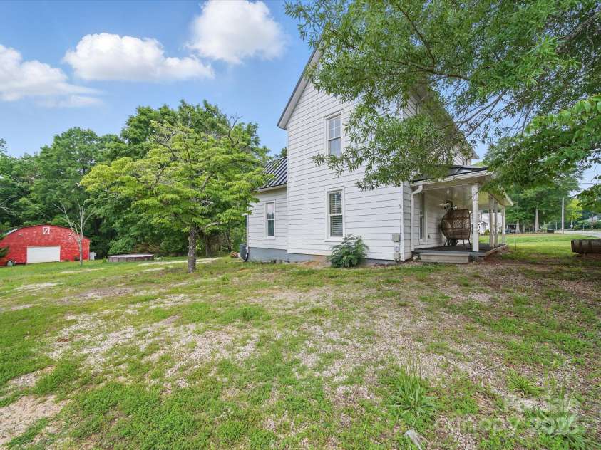 828 Main Street, Mount Pleasant, NC 28124.  MLS# CAR4264431, YatesRealty ID 22637. Opposite side view - 30x40 barn can be seen