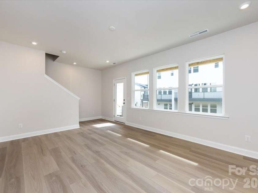 909 Archway Lane, Charlotte, NC 28217.  MLS# CAR4351852, YatesRealty ID 22641. First Floor Flex Space with Ample Natural Light