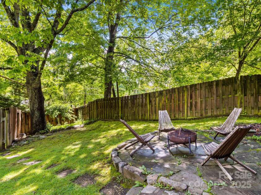 24 Iroquois Street, Black Mountain, NC 28711.  MLS# CAR4251240, YatesRealty ID 22645. Private Fenced Yard w/Fire Pit