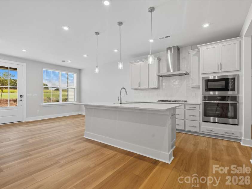 121 Armstrong Road, Belmont, NC 28012.  MLS# CAR4361247, YatesRealty ID 22646. Gourmet kitchen with white cabinets