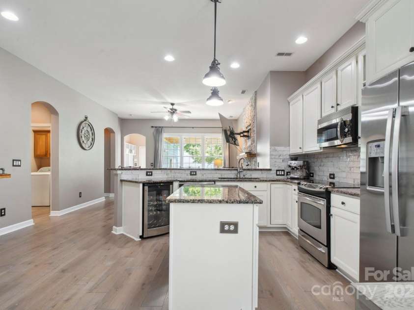 17711 North Shore Circle, Cornelius, NC 28031.  MLS# CAR4273931, YatesRealty ID 22646. Kitchen island offers even more counter space