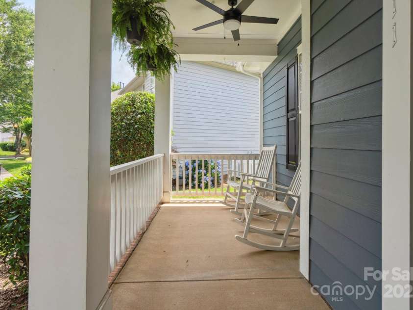 17711 North Shore Circle, Cornelius, NC 28031.  MLS# CAR4273931, YatesRealty ID 22646. Rocking chair front porch perfect for morning coffee