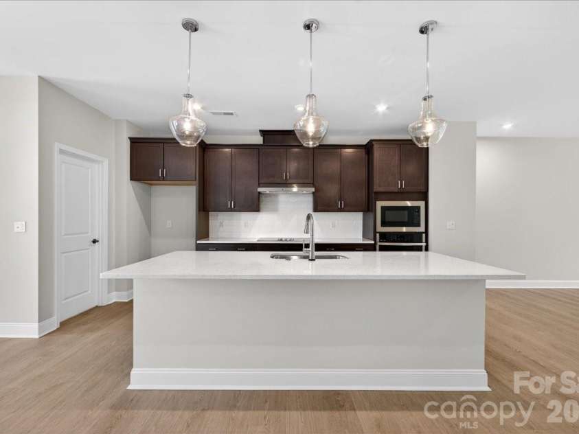 7933 Cedarsmith Court, Charlotte, NC 28217.  MLS# CAR4367732, YatesRealty ID 22647. Gourmet kitchen with large island