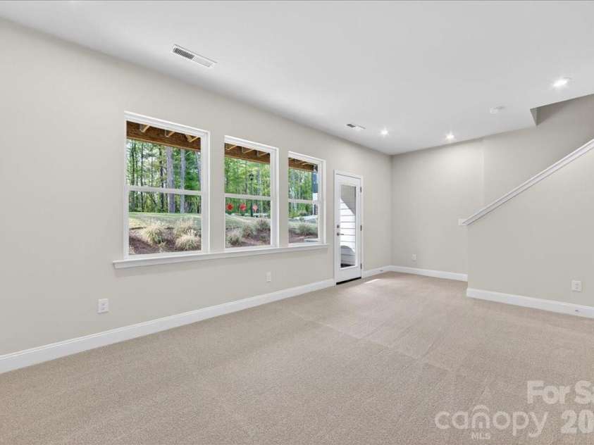 7933 Cedarsmith Court, Charlotte, NC 28217.  MLS# CAR4367732, YatesRealty ID 22647. Light filled first floor flex space