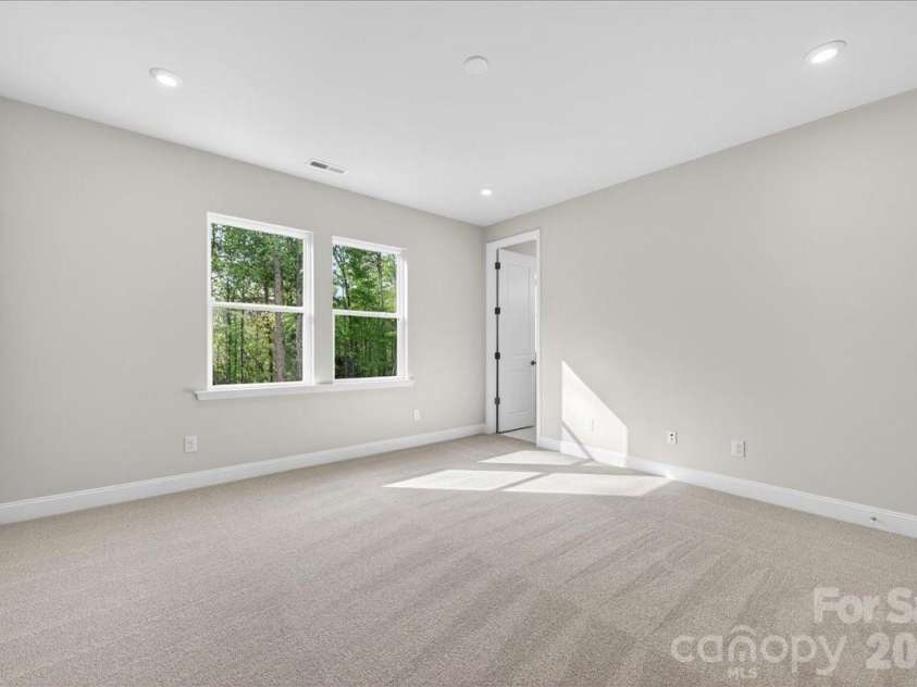 7933 Cedarsmith Court, Charlotte, NC 28217.  MLS# CAR4367732, YatesRealty ID 22647. Light filled primary bedroom