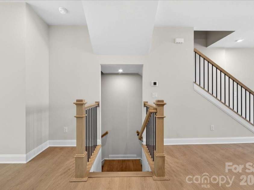 7933 Cedarsmith Court, Charlotte, NC 28217.  MLS# CAR4367732, YatesRealty ID 22647. Second floor landing and Metal Open Rails