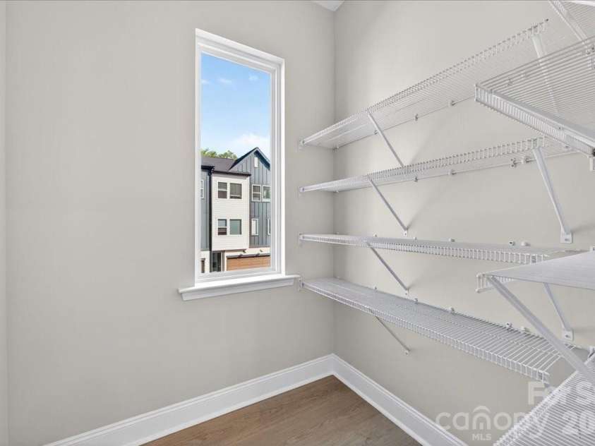 7933 Cedarsmith Court, Charlotte, NC 28217.  MLS# CAR4367732, YatesRealty ID 22647. Walk-in Kitchen Pantry with Window