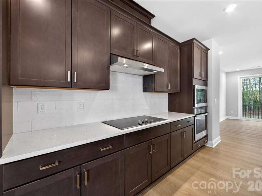 7933 Cedarsmith Court, Charlotte, NC 28217.  MLS# CAR4367732, YatesRealty ID 22647. White quartz countertops and white backsplash