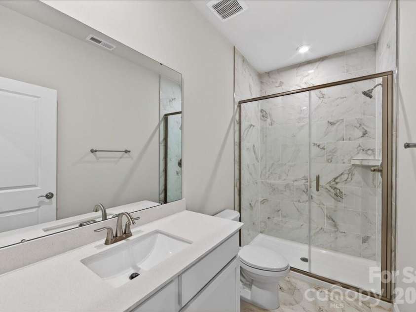 7921 Cedarsmith Court, Charlotte, NC 28217.  MLS# CAR4367826, YatesRealty ID 22649. First floor full bathroom